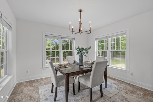 2575 Primrose Ln, Creedmoor, NC 27522 - dining area featuring a chandelier and light stone finish flooring