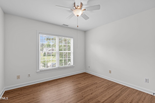 2575 Primrose Ln, Creedmoor, NC 27522 - spare room featuring wood finished floors and ceiling fan