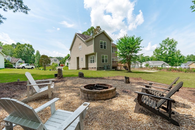 2575 Primrose Ln, Creedmoor, NC 27522 - back of house featuring an outdoor fire pit, a yard, and crawl space