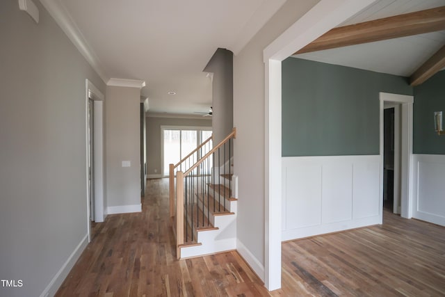 913 Harrison Ridge Rd, Wake Forest, NC 27587 - hallway with wood finished floors, stairway, a wainscoted wall, ornamental molding, and beamed ceiling