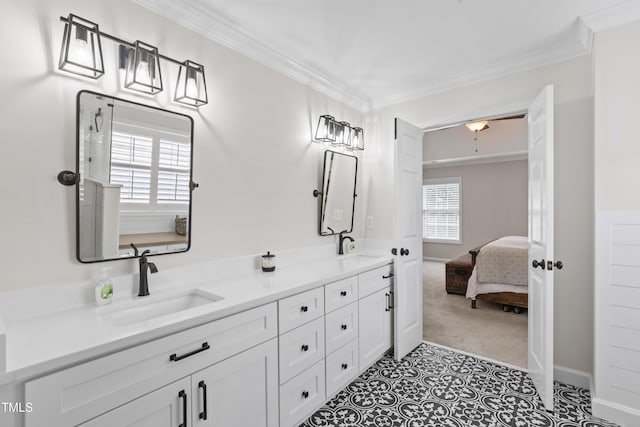 107 Trackimire Ln, Apex, NC 27539 - ensuite bathroom featuring double vanity, crown molding, and baseboards