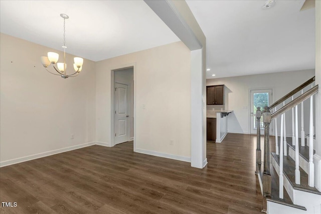 131 Hawick Ct, Zebulon, NC 27597 - empty room with a chandelier, dark wood-type flooring, and stairs