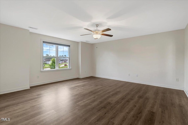 131 Hawick Ct, Zebulon, NC 27597 - spare room with ceiling fan and dark wood-style floors