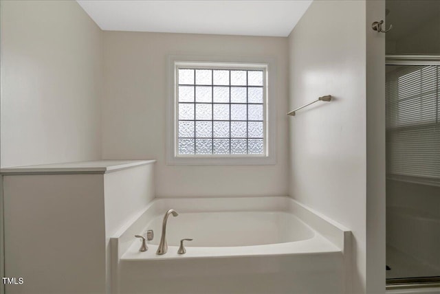 131 Hawick Ct, Zebulon, NC 27597 - full bath featuring a garden tub and a stall shower