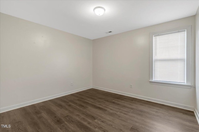 131 Hawick Ct, Zebulon, NC 27597 - unfurnished room with dark wood finished floors and baseboards