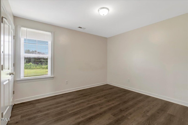131 Hawick Ct, Zebulon, NC 27597 - empty room with dark wood-type flooring and baseboards