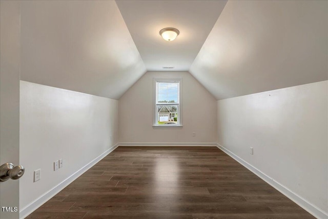131 Hawick Ct, Zebulon, NC 27597 - additional living space featuring lofted ceiling and dark wood-type flooring