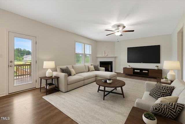 131 Hawick Ct, Zebulon, NC 27597 - living room with a ceiling fan, wood finished floors, and a fireplace