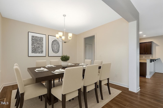 131 Hawick Ct, Zebulon, NC 27597 - dining space featuring a chandelier, dark wood finished floors, and recessed lighting