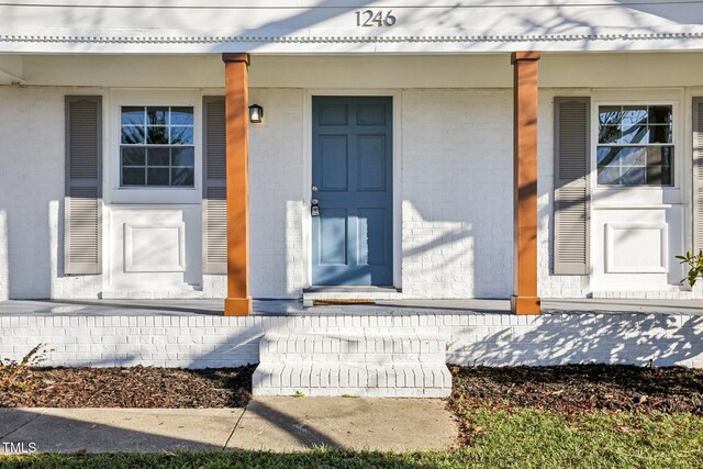 1246 NC-27, Benson, NC 27504 - property entrance with covered porch and brick siding