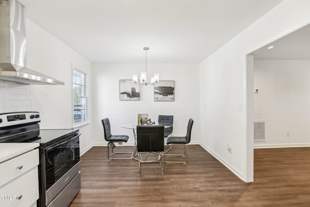 1246 NC-27, Benson, NC 27504 - dining area featuring a chandelier, dark wood-style floors, and baseboards