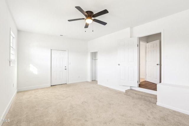 1246 NC-27, Benson, NC 27504 - unfurnished bedroom with light colored carpet, baseboards, and ceiling fan