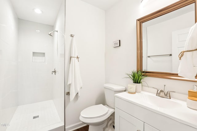1246 NC-27, Benson, NC 27504 - bathroom featuring a tile shower, vanity, toilet, and recessed lighting