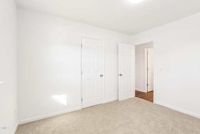 1246 NC-27, Benson, NC 27504 - unfurnished bedroom featuring carpet and baseboards