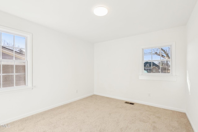 1246 NC-27, Benson, NC 27504 - carpeted spare room featuring healthy amount of natural light and baseboards
