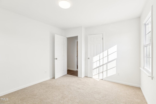 1246 NC-27, Benson, NC 27504 - unfurnished room with carpet flooring, healthy amount of natural light, and baseboards