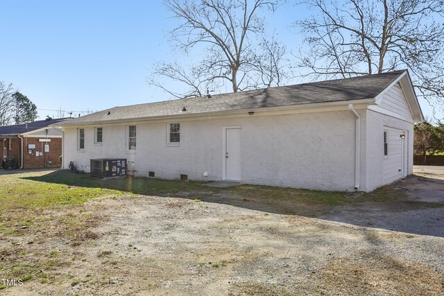 1246 NC-27, Benson, NC 27504 - back of property with central air condition unit and brick siding