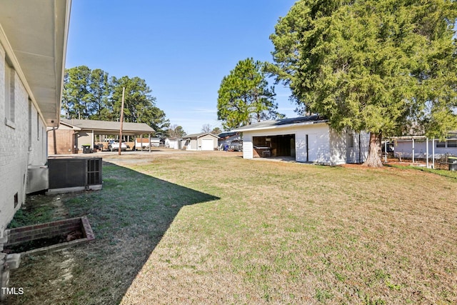 1246 NC-27, Benson, NC 27504 - view of grassy yard with an outbuilding and central AC unit