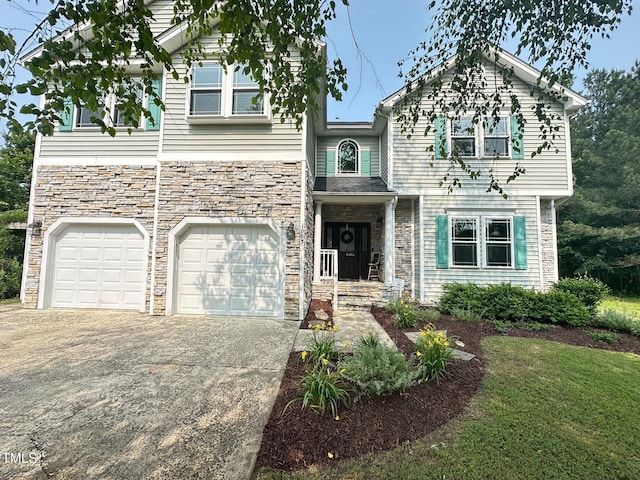 1003 Burnt Hickory Ct, Apex, NC 27502 - view of front of house with stone siding, driveway, and a garage