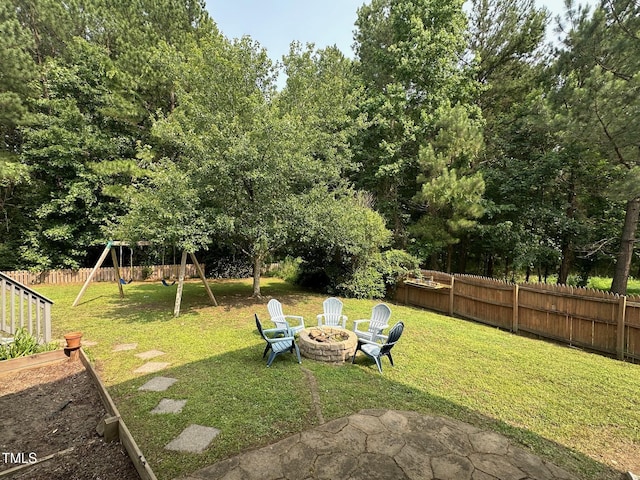 1003 Burnt Hickory Ct, Apex, NC 27502 - view of yard featuring a playground, an outdoor fire pit, and a vegetable garden