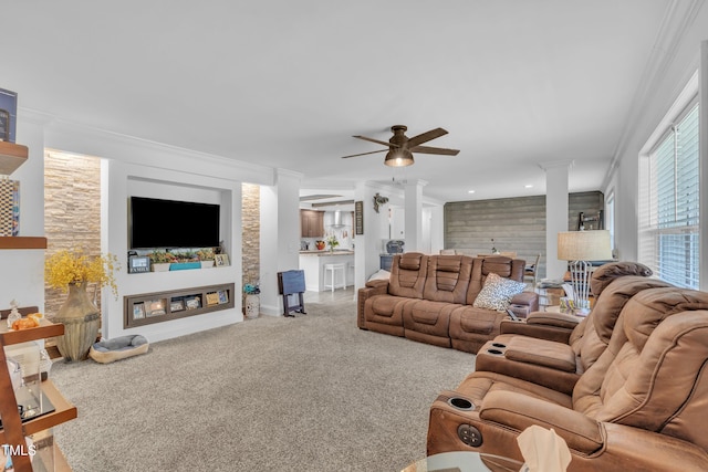 1118 Oakridge Duncan Rd, Fuquay Varina, NC 27526 - living area with a ceiling fan, carpet flooring, crown molding, and ornate columns