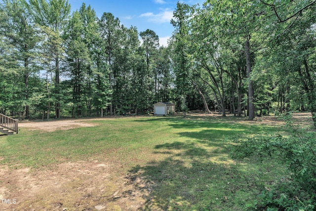 1118 Oakridge Duncan Rd, Fuquay Varina, NC 27526 - view of green lawn with a forest view