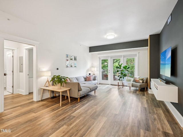 222 Glenwood Ave Unit 213, Raleigh, NC 27603 - living room featuring light wood finished floors, french doors, and electric panel