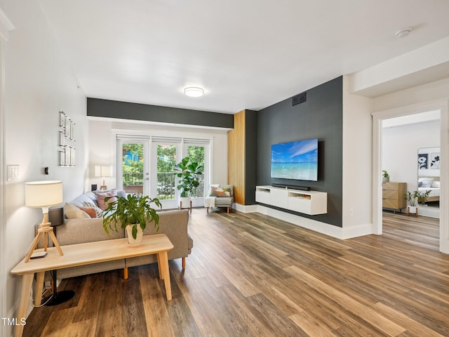 222 Glenwood Ave Unit 213, Raleigh, NC 27603 - living area with wood finished floors and baseboards
