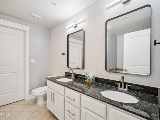 222 Glenwood Ave Unit 213, Raleigh, NC 27603 - bathroom featuring double vanity and tile patterned floors