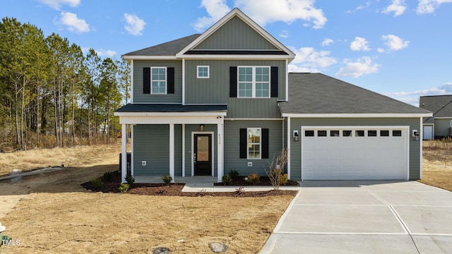 4529 Sweet Williams Ln, Wilson, NC 27896 - view of front facade with a garage, driveway, covered porch, and a shingled roof
