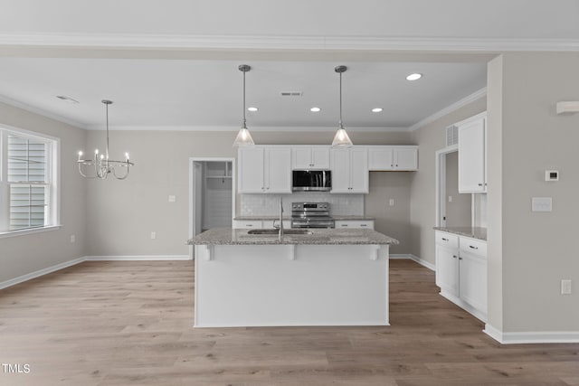 4529 Sweet Williams Ln, Wilson, NC 27896 - kitchen featuring stainless steel appliances, a sink, white cabinets, tasteful backsplash, and crown molding
