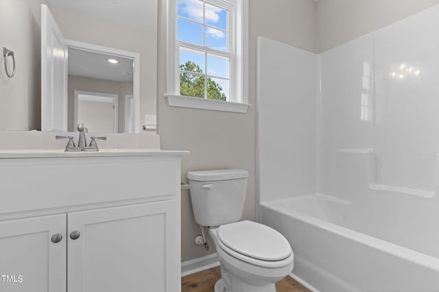 4529 Sweet Williams Ln, Wilson, NC 27896 - bathroom with toilet, vanity, tub / shower combination, and baseboards