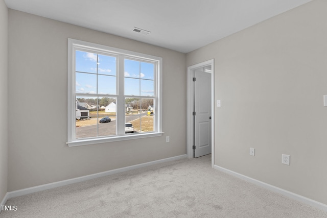 4529 Sweet Williams Ln, Wilson, NC 27896 - spare room featuring healthy amount of natural light, baseboards, and carpet floors