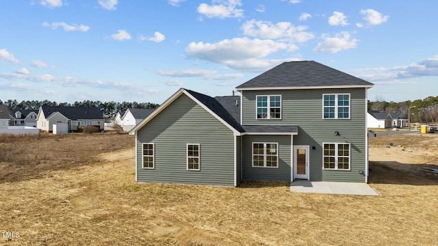 4529 Sweet Williams Ln, Wilson, NC 27896 - rear view of property featuring a patio, roof with shingles, and a lawn