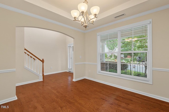 210 Strolling Way, Durham, NC 27707 - empty room featuring arched walkways, wood finished floors, stairs, a chandelier, and baseboards