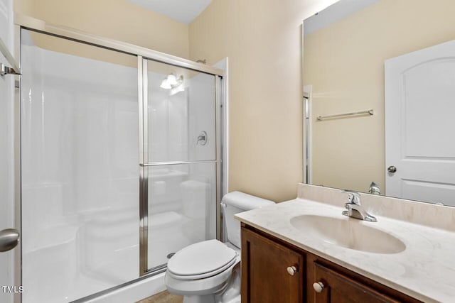 210 Strolling Way, Durham, NC 27707 - bathroom featuring vanity, a shower stall, and toilet