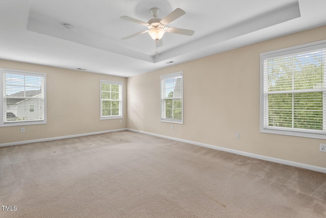 210 Strolling Way, Durham, NC 27707 - empty room with a raised ceiling, baseboards, light colored carpet, and a ceiling fan