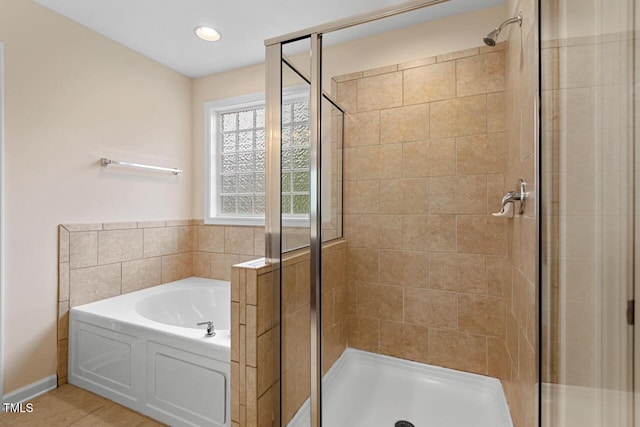 210 Strolling Way, Durham, NC 27707 - full bath featuring a shower stall, a garden tub, and baseboards