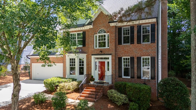 405 Widdington Ln, Cary, NC 27519 - georgian-style home featuring brick siding, driveway, and a shingled roof