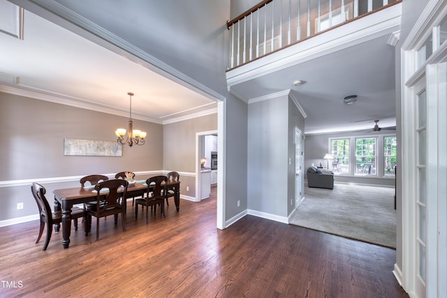405 Widdington Ln, Cary, NC 27519 - dining space with dark wood-style floors, a chandelier, crown molding, and ceiling fan