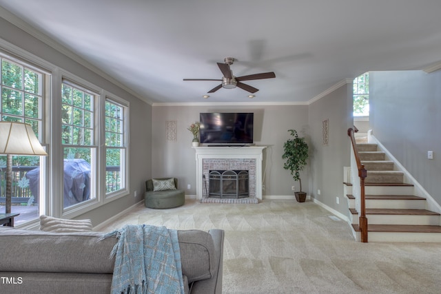 405 Widdington Ln, Cary, NC 27519 - living room featuring plenty of natural light, a ceiling fan, carpet floors, stairs, and ornamental molding