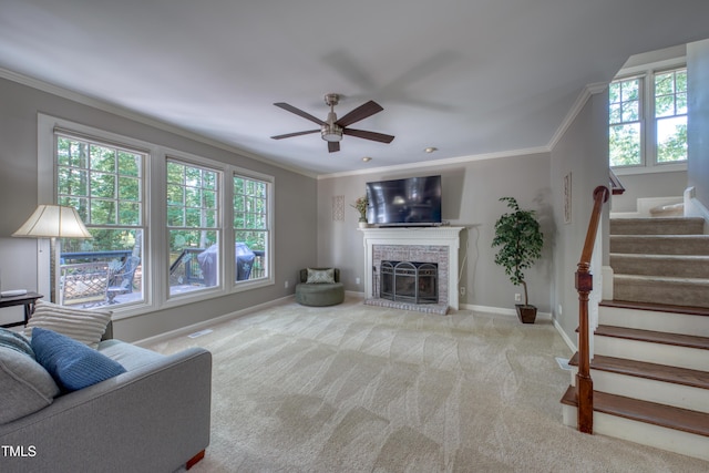 405 Widdington Ln, Cary, NC 27519 - living area with ornamental molding, a ceiling fan, stairs, carpet floors, and a brick fireplace