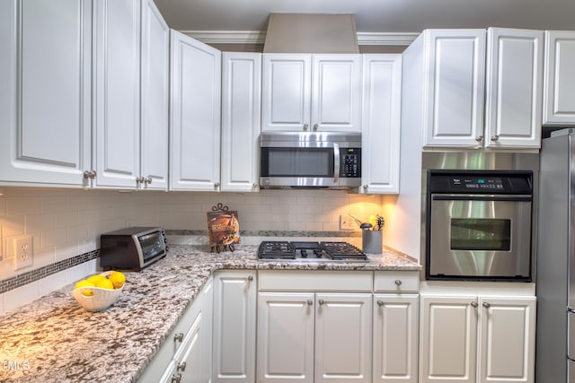 405 Widdington Ln, Cary, NC 27519 - kitchen with appliances with stainless steel finishes, white cabinetry, and tasteful backsplash