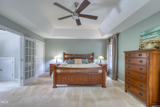 405 Widdington Ln, Cary, NC 27519 - bedroom with a raised ceiling, light colored carpet, and ceiling fan