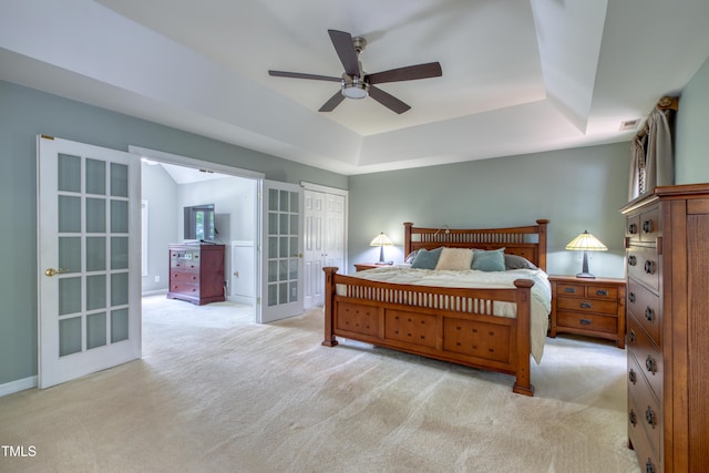 405 Widdington Ln, Cary, NC 27519 - bedroom with light colored carpet, a raised ceiling, french doors, a closet, and ceiling fan