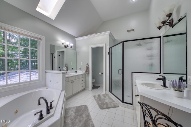 405 Widdington Ln, Cary, NC 27519 - full bath with a skylight, two vanities, a shower stall, plenty of natural light, and lofted ceiling