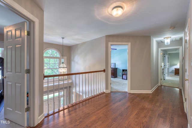 405 Widdington Ln, Cary, NC 27519 - hall featuring dark wood finished floors and baseboards