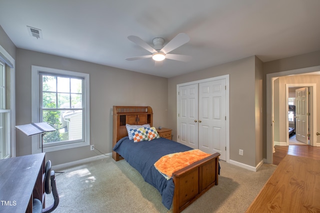 405 Widdington Ln, Cary, NC 27519 - carpeted bedroom featuring a closet and ceiling fan