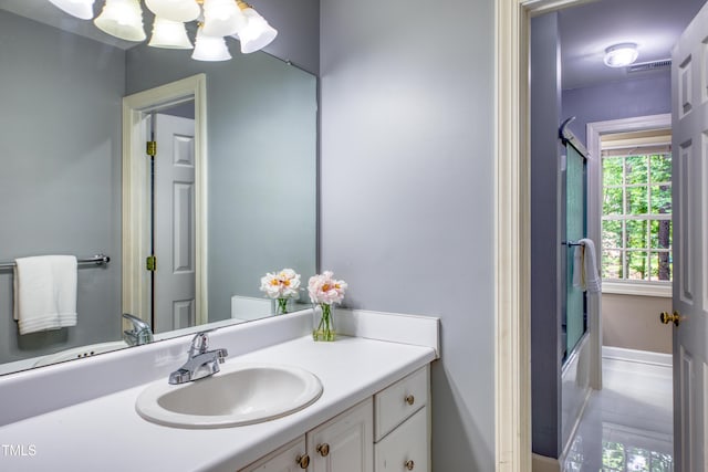 405 Widdington Ln, Cary, NC 27519 - full bath with vanity, a chandelier, and shower / bath combination with glass door
