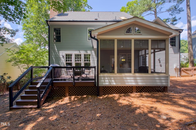 405 Widdington Ln, Cary, NC 27519 - rear view of property featuring a sunroom, a wooden deck, stairway, and a chimney
